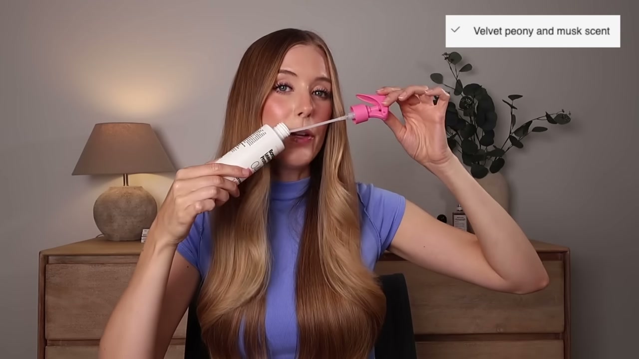 @abbeyyung reviewing Not Your Mother's Tough Love Bonding Leave-in Protector at 09:11 in a YouTube Shorts video