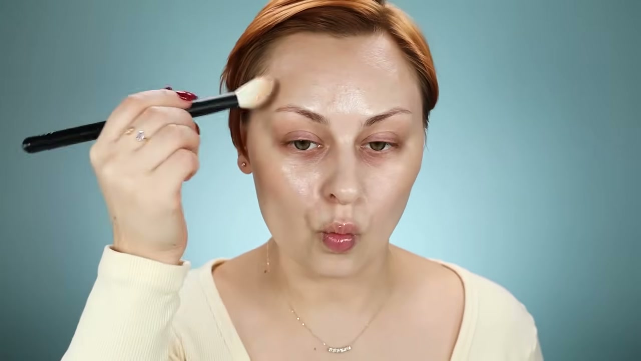 @alexandraanele reviewing Glossier Cloud Paint at 12:01 in a YouTube Shorts video
