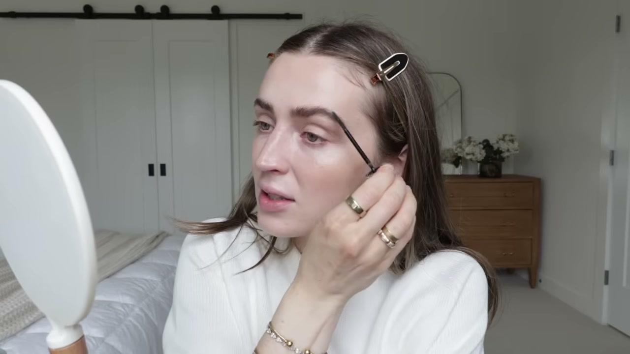 @allanaramaa reviewing Benefit Cosmetics 24-Hour Brow Gel at 07:45 in a YouTube Shorts video