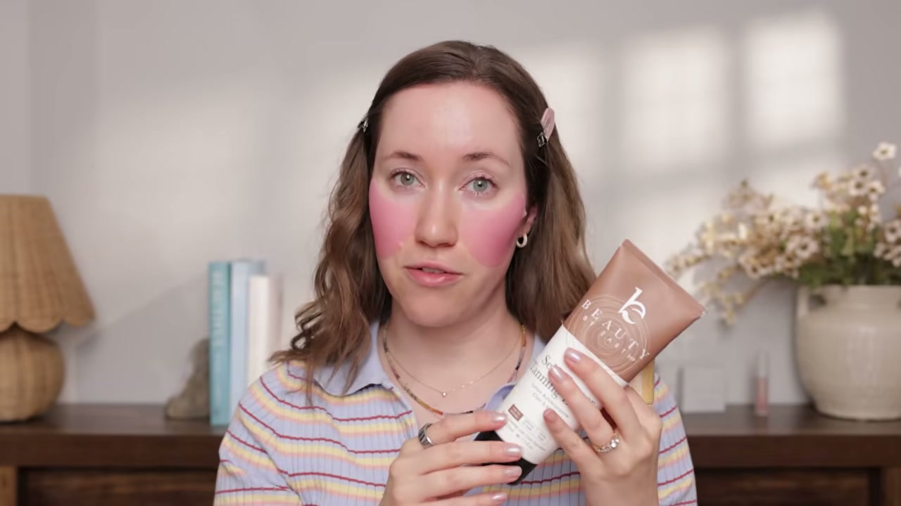 @allieglines reviewing Beauty by Earth Self Tan Tanning Lotion at 04:12 in a YouTube Shorts video