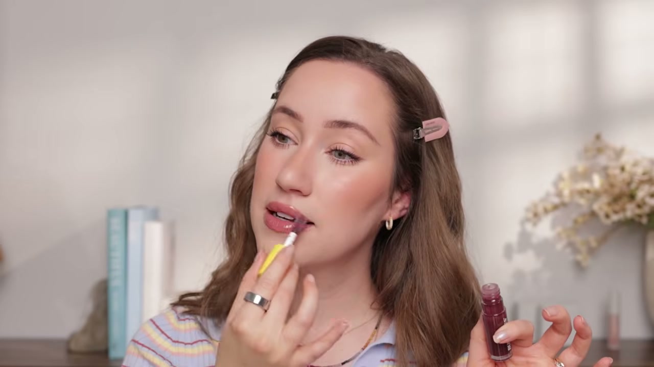 @allieglines reviewing Burt's Bees Tinted Lip Oil at 18:20 in a YouTube Shorts video