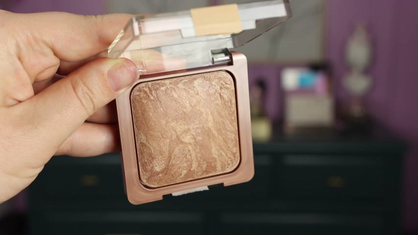@amylovesmakeup reviewing CoverGirl Baked Bronzer at 07:12 in a YouTube Shorts video