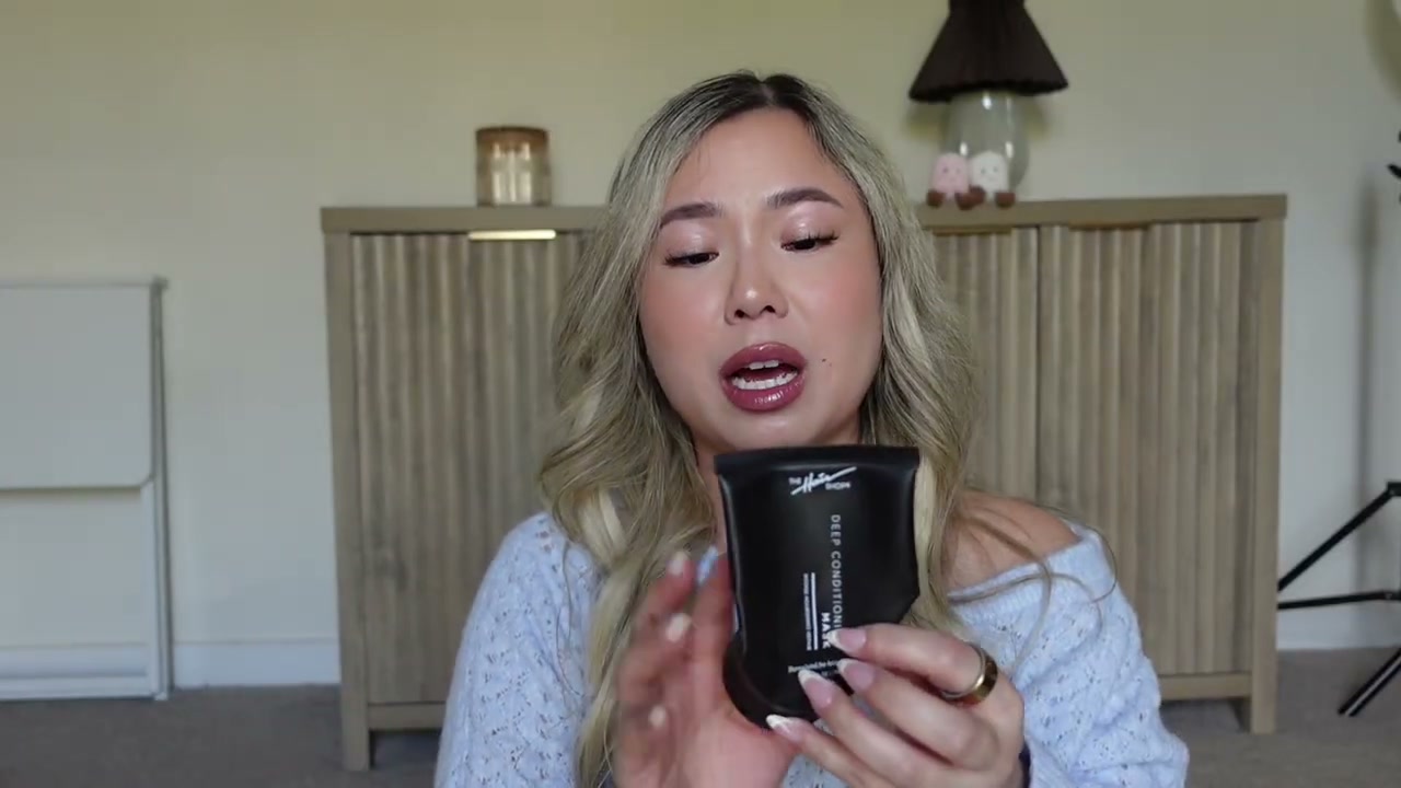 @amyswanofficial reviewing The Hair Shop Deep Conditioning Mask Intense Nourishing Repair at 06:43 in a YouTube Shorts video
