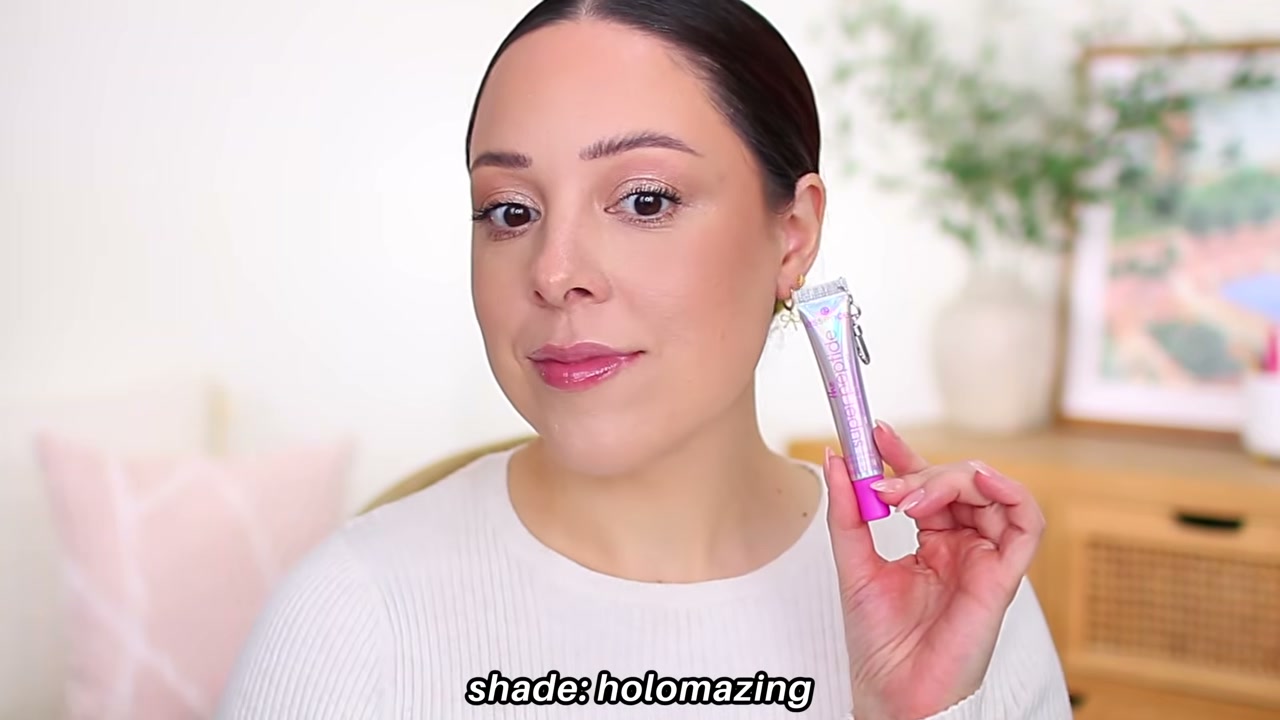 @andreamatillano reviewing Essence Super Peptide Glossy Lip Treatment at 03:44 in a YouTube Shorts video