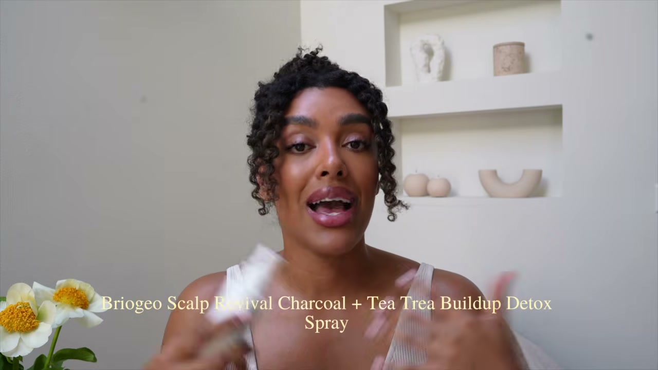 @angela.onuoha reviewing Briogeo Scalp Revival Charcoal + Tea Tree Buildup Detox Spray at 13:43 in a YouTube Shorts video