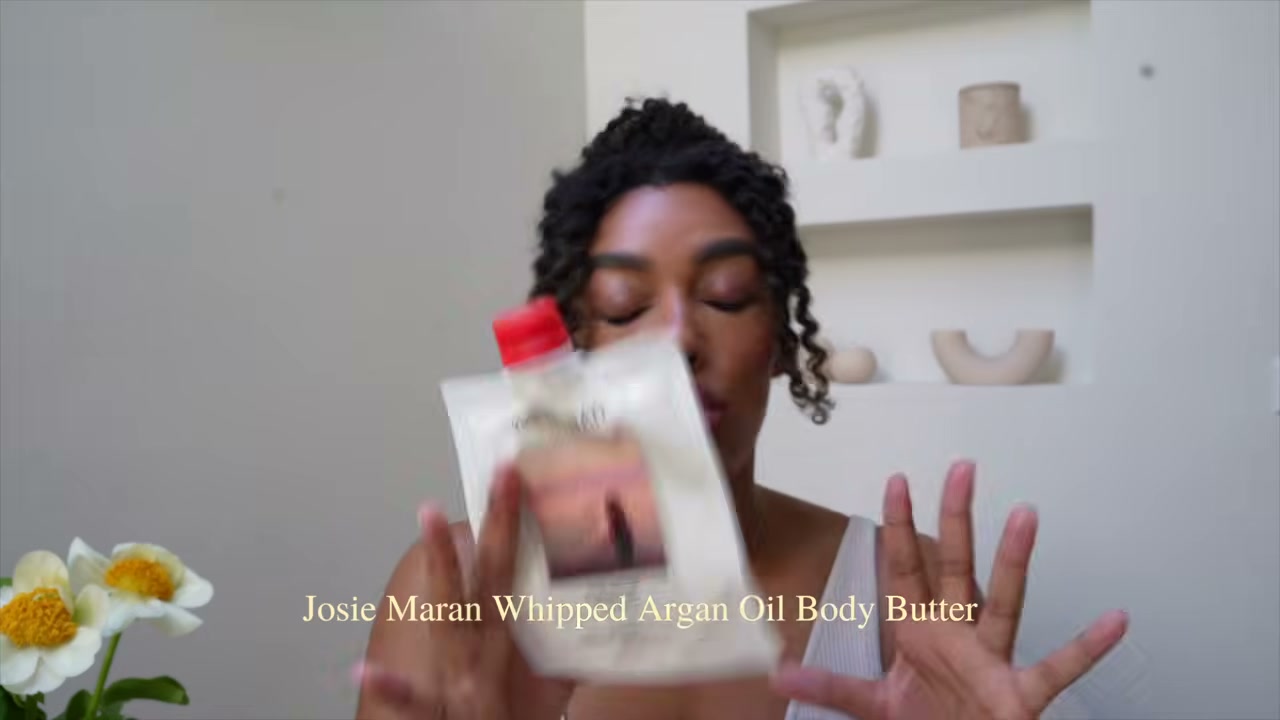 @angela.onuoha reviewing Josie Maran Whipped Argan Oil Body Butter at 04:46 in a YouTube Shorts video
