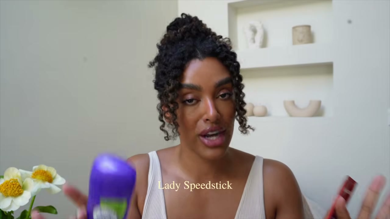 @angela.onuoha reviewing Lady Speed Stick Invisible Dry at 16:36 in a YouTube Shorts video