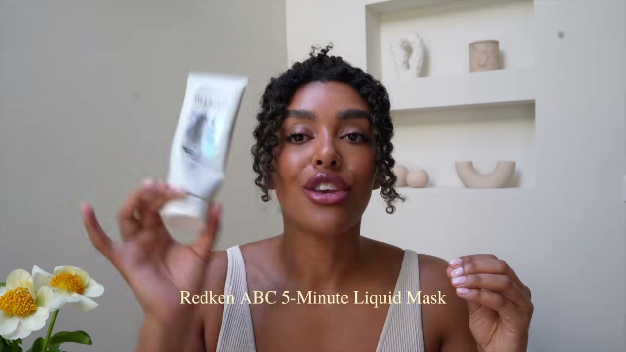 @angela.onuoha reviewing Redken Acidic Bonding Concentrate 5-Minute Liquid Mask at 12:31 in a YouTube Shorts video