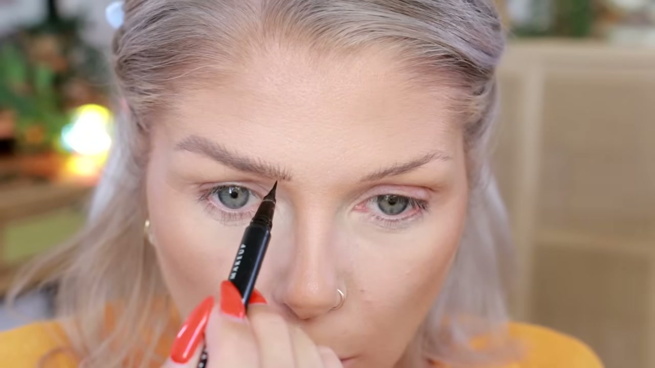 @angelicanyqvist reviewing NYX Lift & Snatch Brow Tint Eyebrow Pen at 16:56 in a YouTube Shorts video