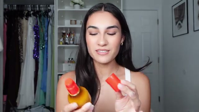 @angelqvintana reviewing Josie Maran Topless Tangerine Body Mist at 07:13 in a YouTube Shorts video