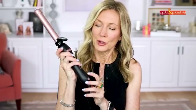 @angiehotandflashy reviewing Beachwaver S1 Curling Iron at 15:14 in a YouTube Shorts video