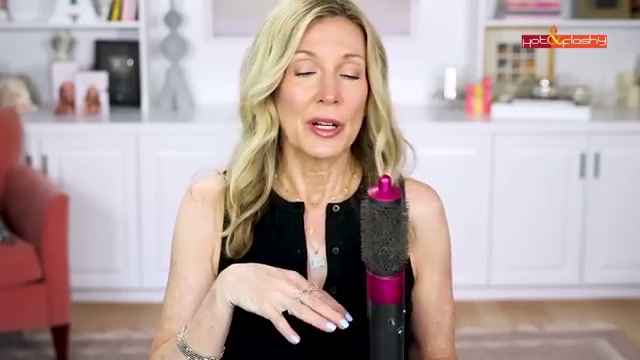 @angiehotandflashy reviewing Dyson Airwrap at 12:55 in a YouTube Shorts video