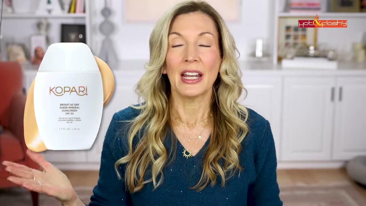 @angiehotandflashy reviewing Kopari Beauty Bright As Day Sheer Mineral Sunscreen SPF 50 at 15:58 in a YouTube Shorts video