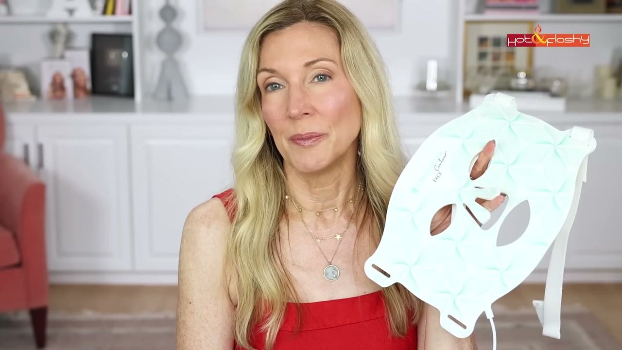 @angiehotandflashy reviewing Omnilux Neck and Chest Bib at 21:17 in a YouTube Shorts video