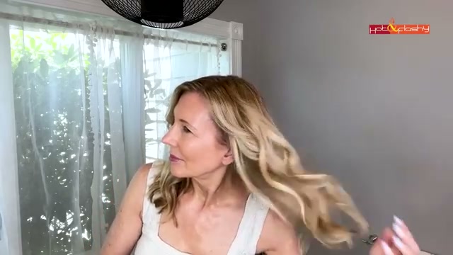 @angiehotandflashy reviewing Oribe Dry Texturizing Spray at 16:26 in a YouTube Shorts video