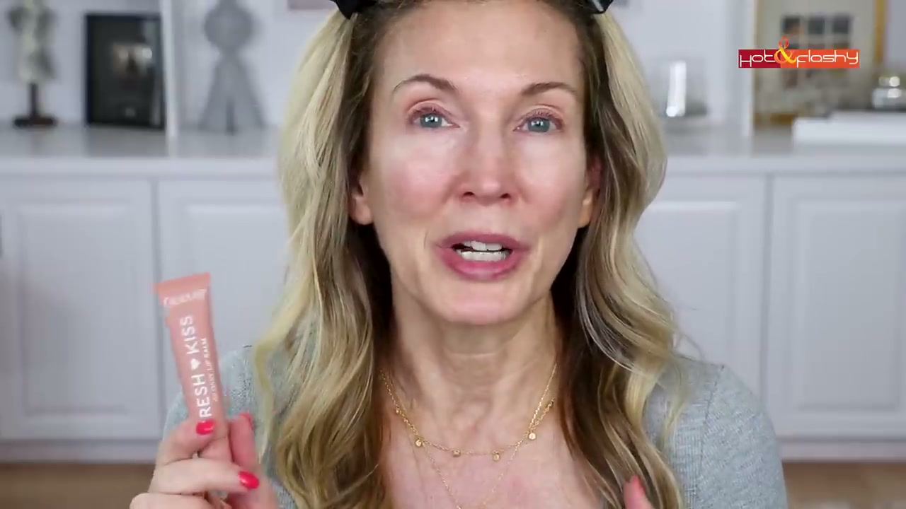 @angiehotandflashy reviewing Tower 28 Beauty Lip Softie at 01:28 in a YouTube Shorts video
