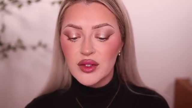 @babsbeauty reviewing Armani Beauty Prisma Glossy Lip Balm at 33:06 in a YouTube Shorts video