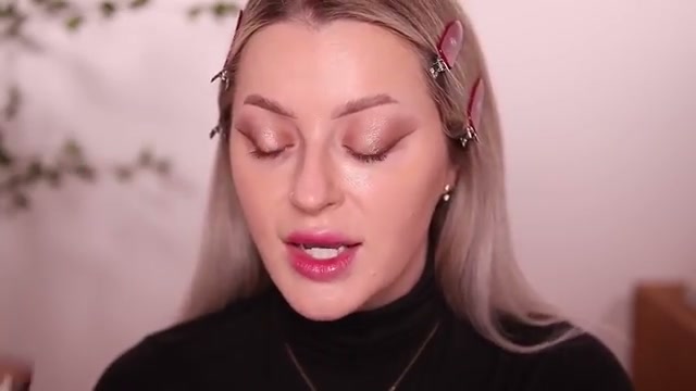 @babsbeauty reviewing Dior Bronze Stick at 18:22 in a YouTube Shorts video