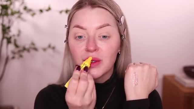 @babsbeauty reviewing Olivia Umma Candy Glow Lip Balm at 00:43 in a YouTube Shorts video