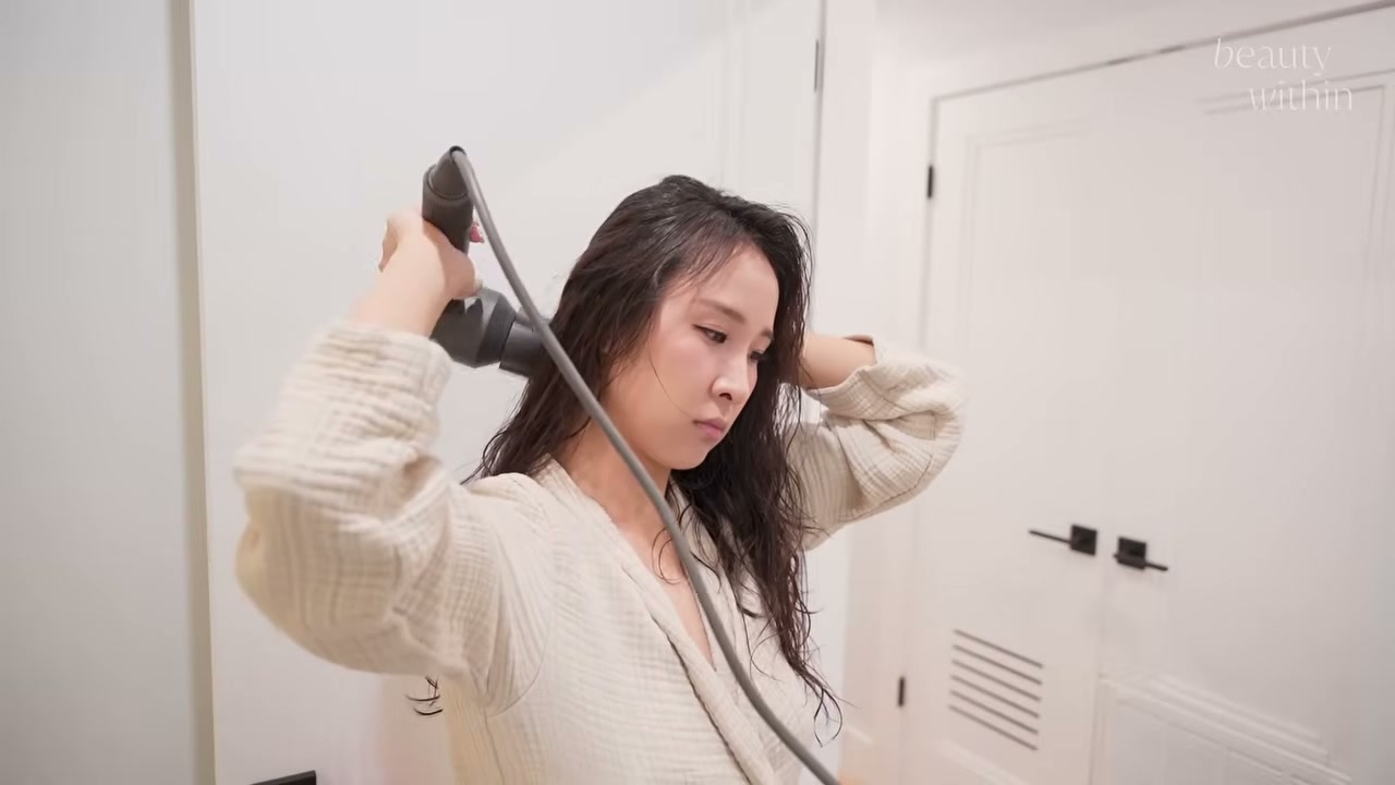 @beautywithin reviewing Dyson Supersonic Hair Dryer at 05:54 in a YouTube Shorts video