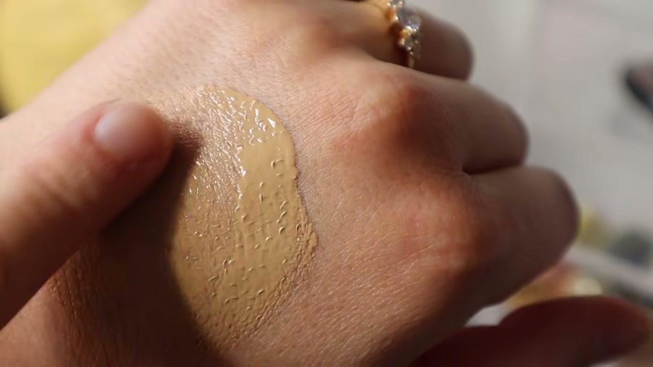 @bornblushing reviewing Lisa Eldridge Seamless Skin Enhancing Tint at 00:52 in a YouTube Shorts video