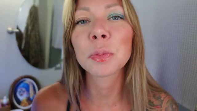 @brittneealexus reviewing Toni Tinted Lip Oil at 12:19 in a YouTube Shorts video
