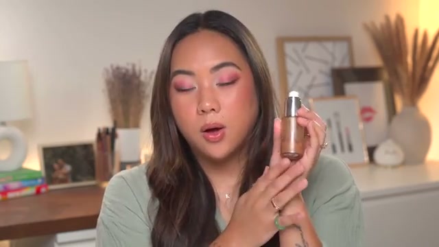 @bykristinastudio reviewing CoverGirl TruBlend Sun & Sculpt Bronzing Glow Serum at 23:05 in a YouTube Shorts video
