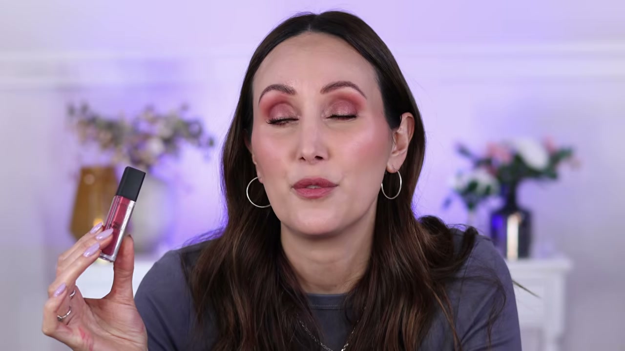@carmelnicolebeauty reviewing Catrice Filler Supreme Lip Gloss at 33:30 in a YouTube Shorts video