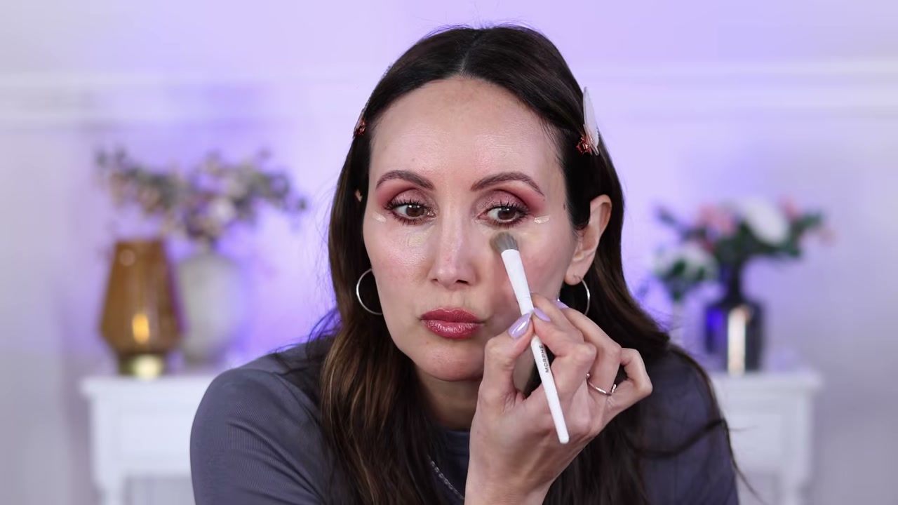 @carmelnicolebeauty reviewing Catrice Instant Bright Serum Concealer at 15:18 in a YouTube Shorts video