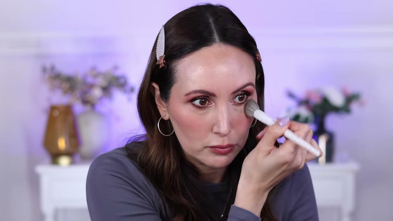 @carmelnicolebeauty reviewing Catrice Under Eye Brightener Setting Powder at 27:53 in a YouTube Shorts video