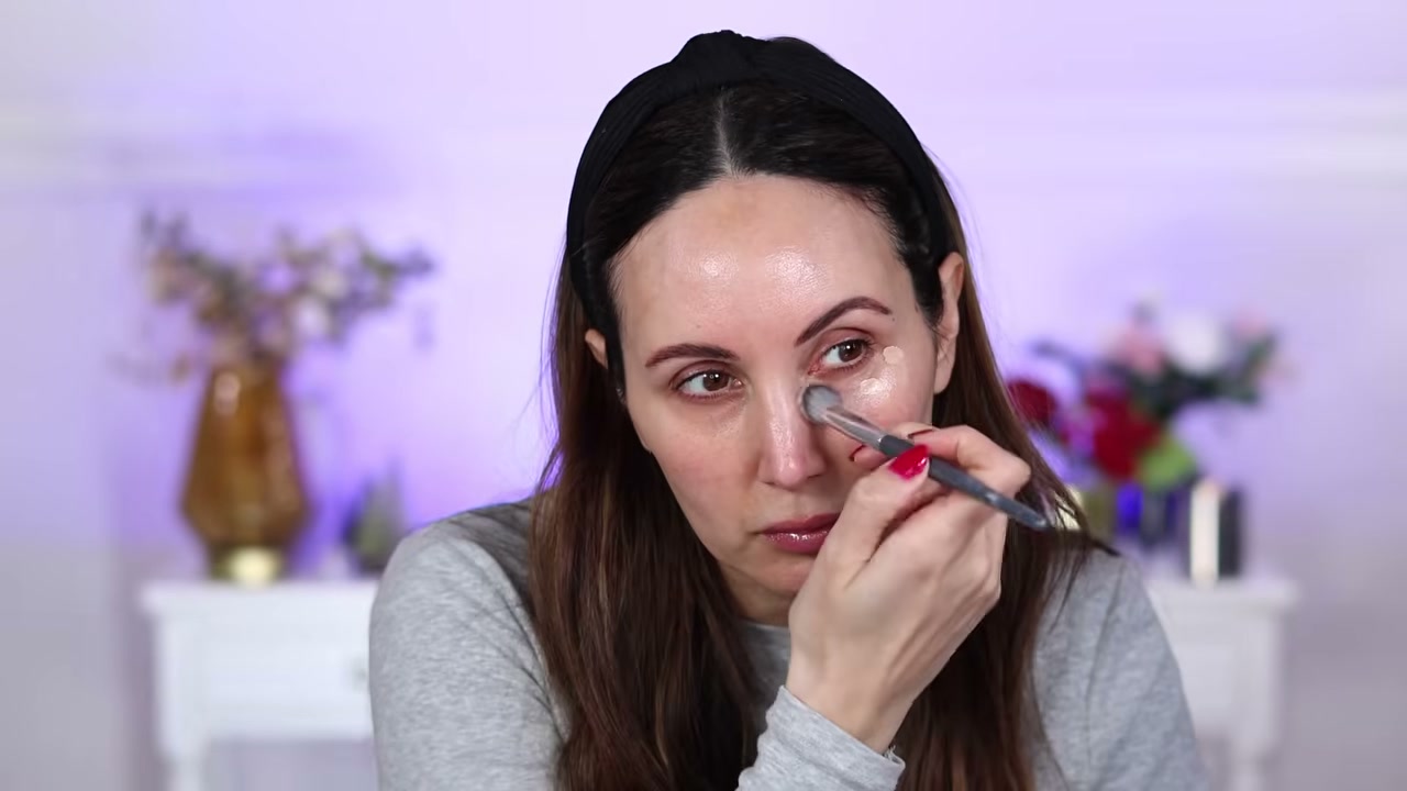@carmelnicolebeauty reviewing CHANEL Ultra Le Teint Concealer at 24:38 in a YouTube Shorts video