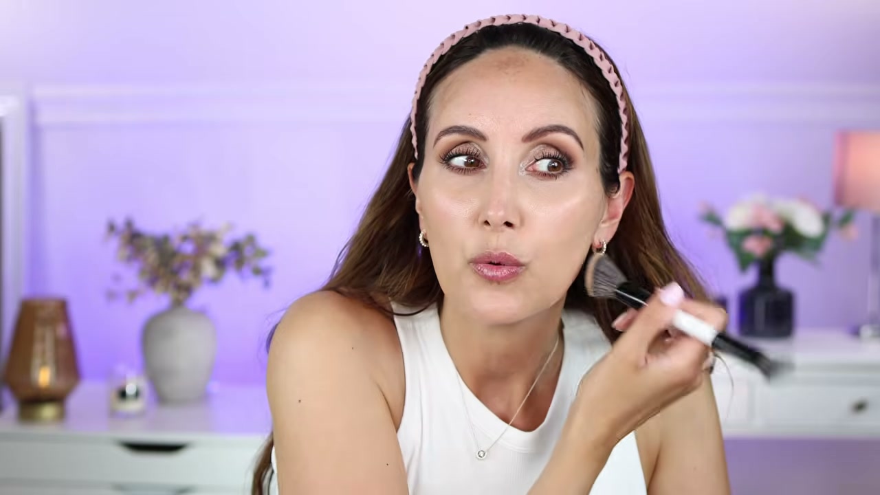 @carmelnicolebeauty reviewing Natasha Denona Hy-Glam Foundation at 10:32 in a YouTube Shorts video