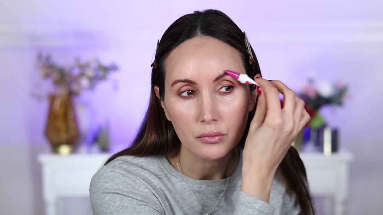 @carmelnicolebeauty reviewing NYX Crazy Lift Brow Glue at 01:16 in a YouTube Shorts video