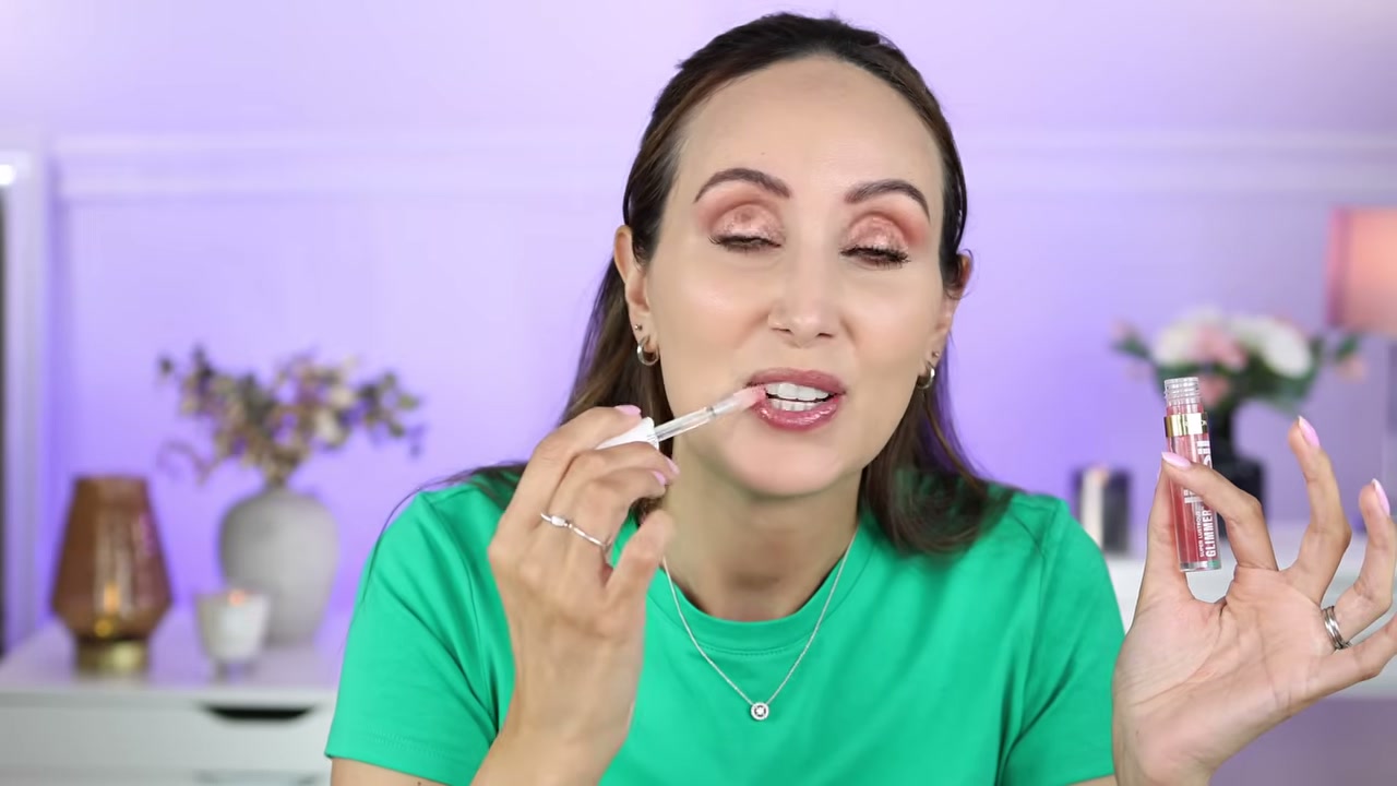 @carmelnicolebeauty reviewing Revlon Super Lustrous Glimmer Lip Oil at 17:45 in a YouTube Shorts video