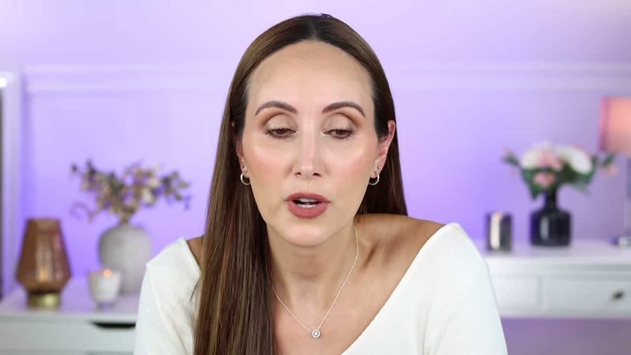 @carmelnicolebeauty reviewing Urban Decay All Nighter Ghosting Setting Powder Spray at 26:25 in a YouTube Shorts video