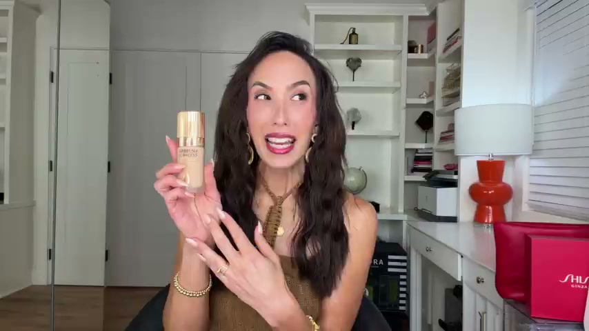 @cherylburke reviewing Charlotte Tilbury Airbrush Flawless Foundation at 07:21 in a YouTube Shorts video