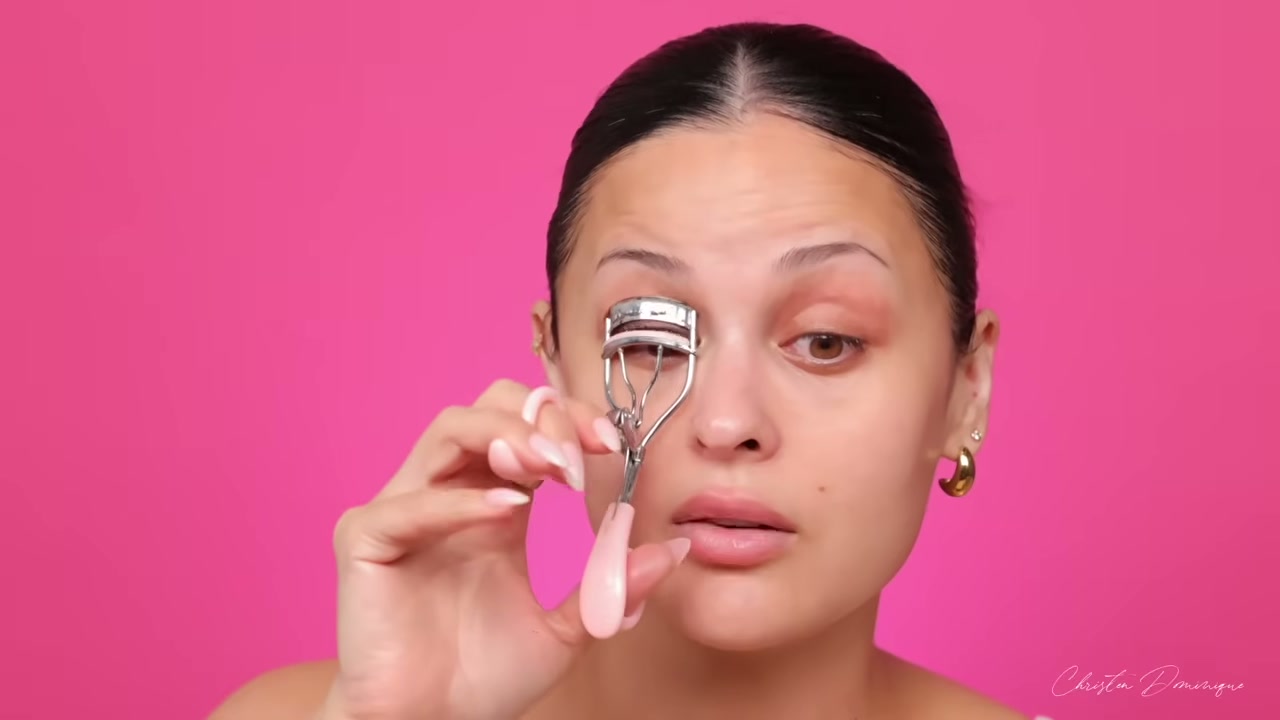 @christendominique reviewing Japonesque Heart Lash Curler at 03:12 in a YouTube Shorts video