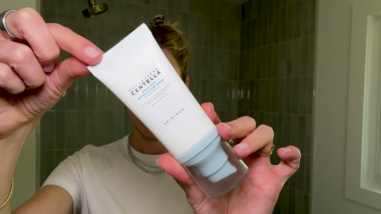 @drsamellis reviewing SKIN1004 Madagascar Centella Hyalu-Cica Water-Fit Sun Serum SPF50 Pa++++ at 03:06 in a YouTube Shorts video