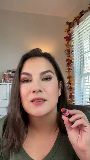 @emilynoel83 reviewing Burt's Bees Tinted Lip Balm Trio at 00:21 in a YouTube Shorts video