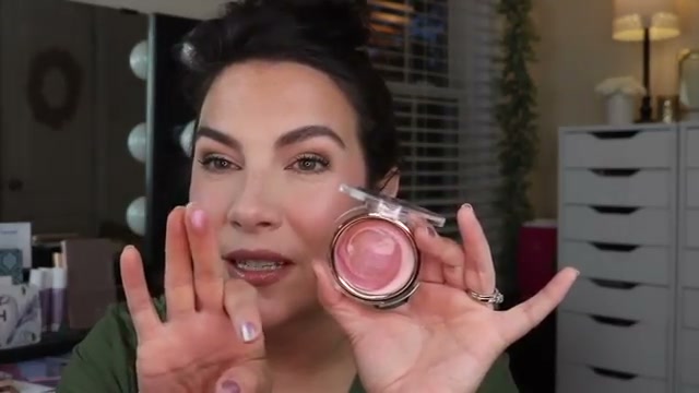 @emilynoel83 reviewing Catrice Aura Glam Balm Highlighter at 16:54 in a YouTube Shorts video