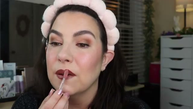 @emilynoel83 reviewing Catrice Filler Supreme Lip Gloss at 26:59 in a YouTube Shorts video