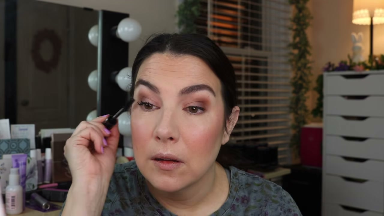 @emilynoel83 reviewing CoverGirl Exhibitionist Stretch & Strengthen Mascara at 24:31 in a YouTube Shorts video