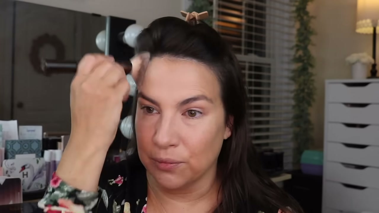 @emilynoel83 reviewing CoverGirl Outlast Extreme Wear Pressed Powder at 07:07 in a YouTube Shorts video