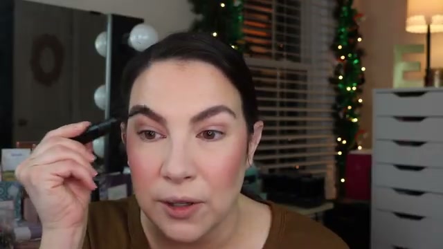 @emilynoel83 reviewing e.l.f. Cosmetics Brow Laminating Gel at 15:34 in a YouTube Shorts video