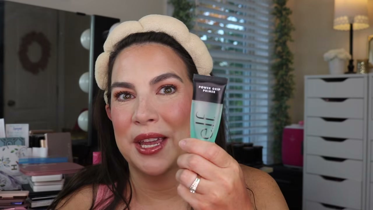 @emilynoel83 reviewing e.l.f. Cosmetics Halo Glow Liquid Filter at 04:10 in a YouTube Shorts video