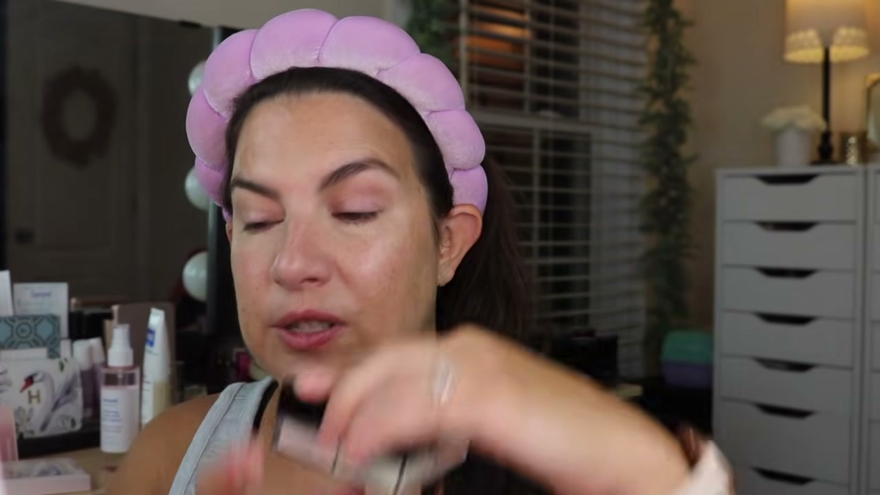 @emilynoel83 reviewing e.l.f. Cosmetics Set It Bright Setting Powder at 04:01 in a YouTube Shorts video