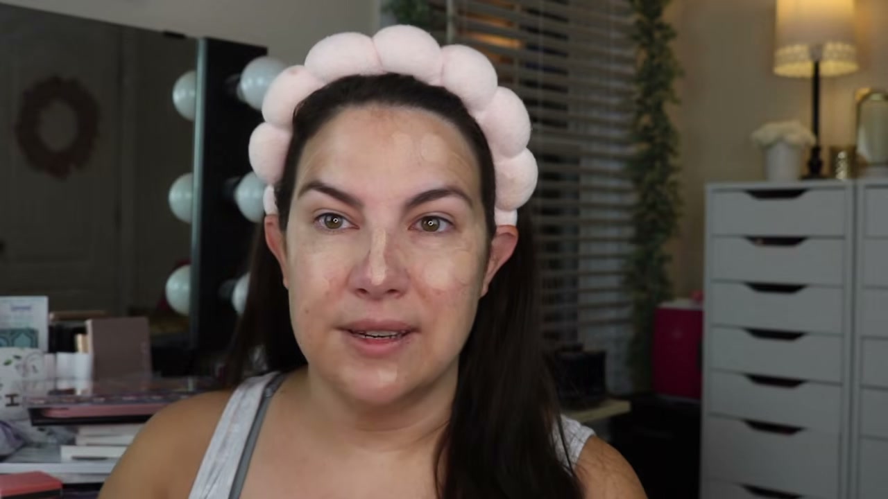 @emilynoel83 reviewing IT Cosmetics Do It All Sheer Tint Face Balm at 03:52 in a YouTube Shorts video
