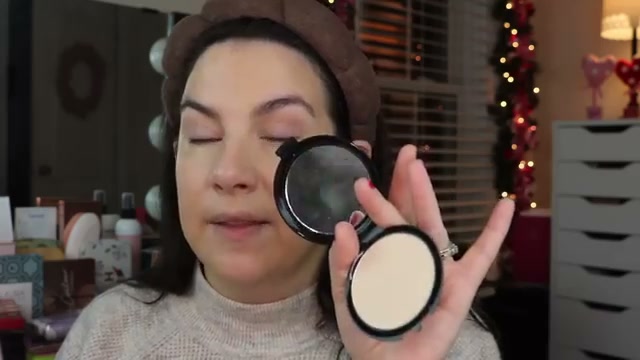 @emilynoel83 reviewing L.A. Colors Pressed Powder at 06:07 in a YouTube Shorts video