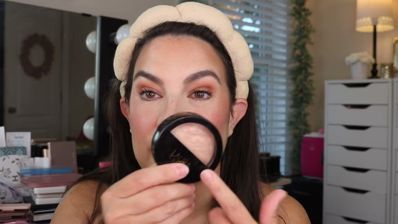 @emilynoel83 reviewing Laura Geller Baked Balance N Brighten at 04:48 in a YouTube Shorts video