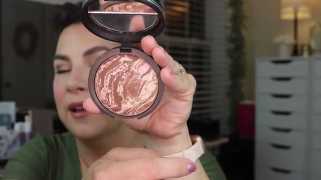 @emilynoel83 reviewing Laura Geller Baked Bronze-n-Brighten Multipurpose Bronzer at 04:21 in a YouTube Shorts video